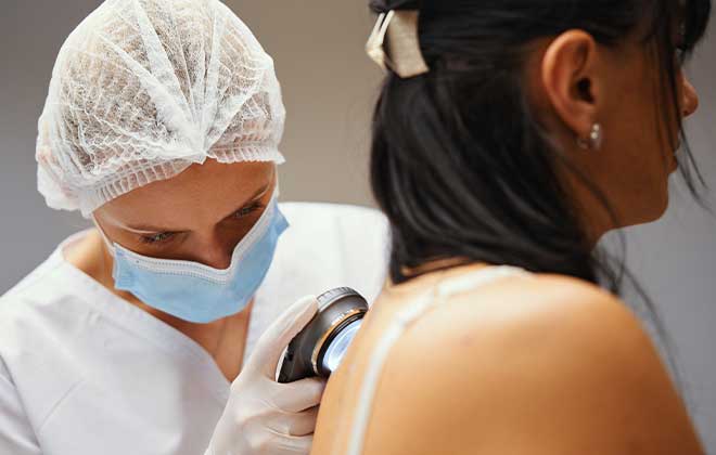 Dermatologist examining a patient’s skin at IASSIS Medical Zakynthos