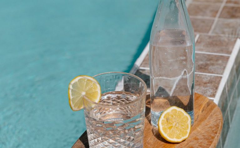 Drink tap water in Zakynthos - glass with lemon by a pool