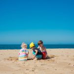 Family beaches Zakynthos – children playing on the sand with calm sea and clear sky