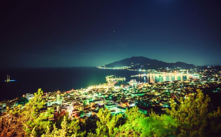 Night view of Zakynthos Town and coastline from a nearby hilltop