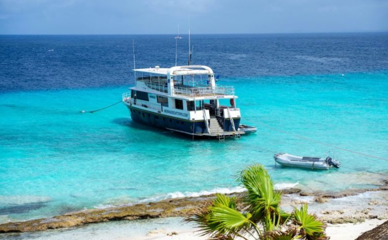 Tourist boat anchored near a turquoise beach in Zakynthos, Greece
