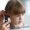 Child having ear examined by doctor for swimmer’s ear at a medical clinic in Zakynthos