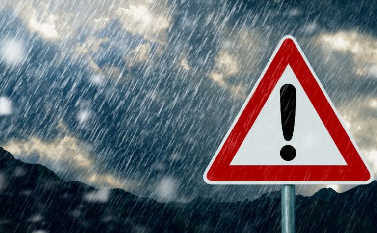 Warning sign during heavy rain – September weather Zakynthos