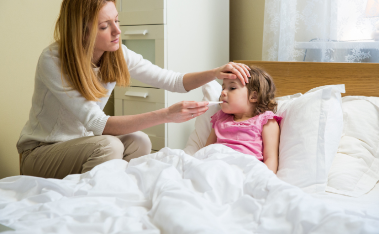 Sick child on holiday in Zakynthos being checked by a doctor