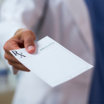 Tourist getting a prescription in Zakynthos from a doctor